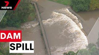 Wild weather across the state threatens major dam to overflow | 7 News Australia