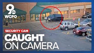 Surveillance cam catches moment woman crashes her vehicle into two men at Kroger