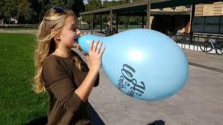 Girls have fun to blow up big balloons too big in public (preview clip)
