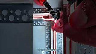 Technician Connecting LED Light Cables with Precision