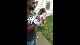 Guy tries to calm a aggressive baby raccoon