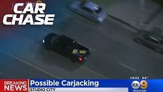 Driver carjacks a pickup truck in the middle of a police pursuit!