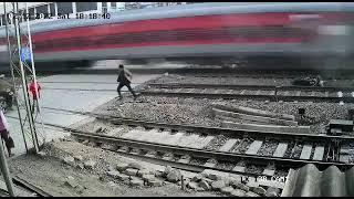 Train accident. Biker narrowly escapes speeding train. Bike and train!