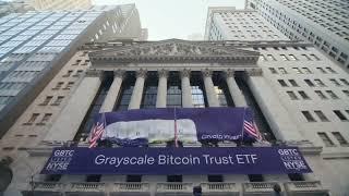 Grayscale spot Bitcoin ETF banner being hung up on Wall Street