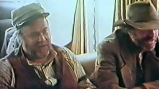 Jack Elam, David Huddleston, John Wayne and George Plimton play cards in a trailer...