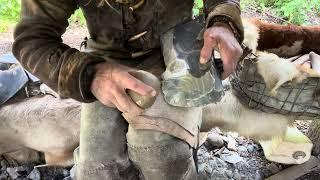 Making a square section flint axe.