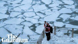 Polar vortex: -46C temperatures as Chicago River turns to ice