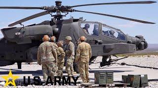 US Army. Powerful AH-64E Apache attack helicopters. Loading and live firing.