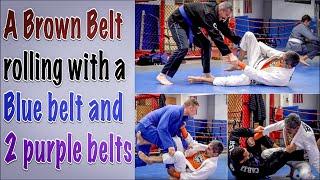 51 year old Brown belt rolling with a Blue belt and 2 Purples