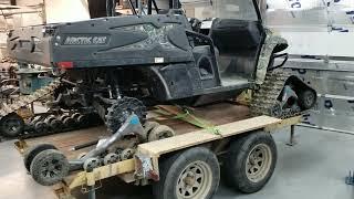 Looking over the damage sustained to a Camoplast T4S track system on the rear of an Arctic Cat UTV