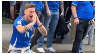 Albanian fans breaking spaghetti in front of Italian fans before the Euro match