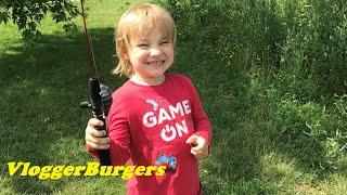 Fishing for the first time 4-year-old boy casts out a new fishing reel that works great with bobber