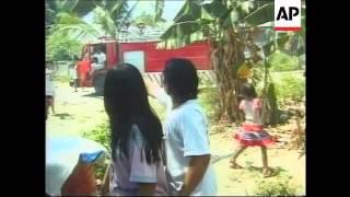 EAST TIMOR: INDONESIAN MILITIA RAID & BURN HOUSES