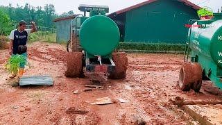 New holland tractor Load 2000 Liter Water Tank on clay road