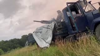 Ukrainian troops firing from a 2B9 Vasilek 82mm automatic mortar launcher from a technical.