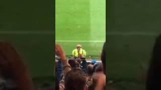 Oldham fans singing to a steward who looked like Boris Johnson at Rochdale. Credit: Bradley Knowles.