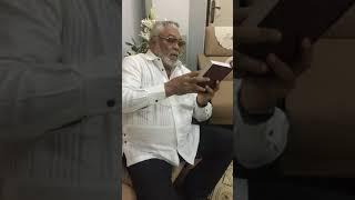 JJ RAWLINGS READING THE  EWE HYMN BOOK