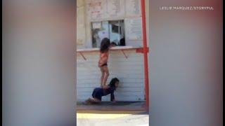 2 young girls team up to reach window at burger joint in El Monte I ABC7