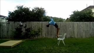 doing a back-flip off of a chair