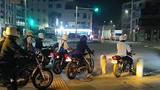 Young bikers and old skyline leaving Enoshima