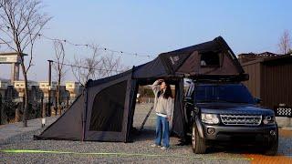 Solo camping in front of the river. Cozy rooftop tent.