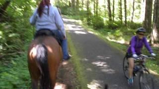 Kryss Cochran Helfrich and Sacredstone with Bicyclist on the BV Trail