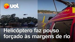 Helicóptero dos bombeiros faz pouso forçado às margens de rio em Goiás e piloto fica ferido