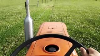 BlackTopMedia mowing the east lawn with our 180mph tractor (warning: camera makes it look slower)