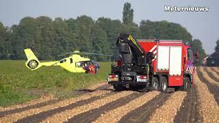 Persoon bekneld in rooimachine Noordbroek