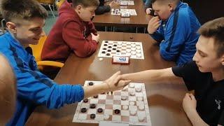 A blitz match of talented draughts youth.