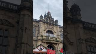 The Palestinian flag being raised at Sheffield Town Hall on UN Day of Solidarity