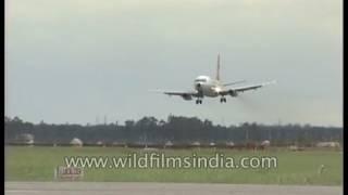 Indian Airlines flight lands at Delhi Airport on monsoon day 23 July 1993