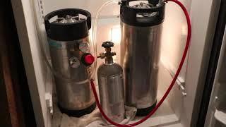 Pouring homemade craft brewed Session IPA from a Cornelius keg with picnic tap