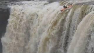 Kayakers go over 90-foot waterfall