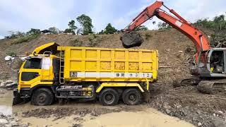 Hitachi Zaxis Excavator Loads Soil into Dump Truck