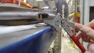 Pressing in a flanged bushing using Knipex 60mm pliers.