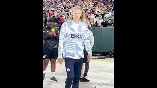 Erling Haaland waves to the crowd at Lambeau Field 