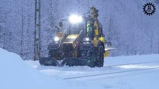 Huddig Rail backhoe loader in snow clearing with Snowsweeper/ snowplow
