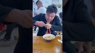 Boy eating chow mein in a Chinese restaurant!