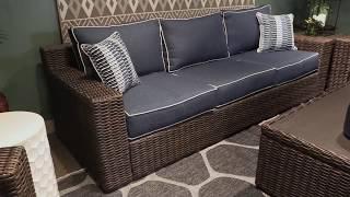 Grasson Lane Brown And Blue Outdoor Sofa With Cushion from Signature Design by Ashley