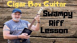 Learn to play 3 string Cigar Box Guitar - Swampy Riff Lesson.