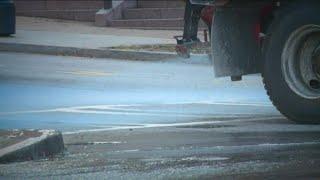 Why do road crews use blue salt to battle winter weather?