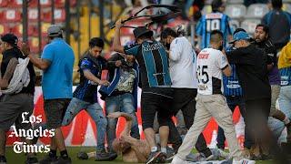 Riot on the soccer field: Fans of rival Liga MX teams in Mexico violently attack each other