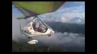 Two microlights taking off Pokhara airport and flying over Tibetan plateau