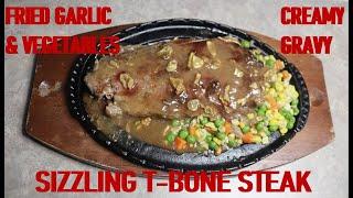 SIZZLING T-BONE STEAK WITH CRISPY FRIED GARLIC, MIXED VEGETABLES AND  CREAMY GRAVY. HOMEMADE RECIPE.