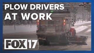 Plow drivers working to clear snow from West Michigan roads