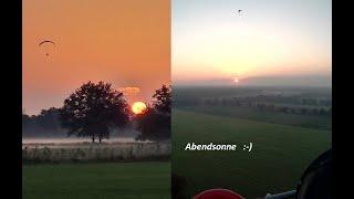 Abendsonne und Nebel mit dem Motorschirm fliegen Paramotor Gleitschirm ppg