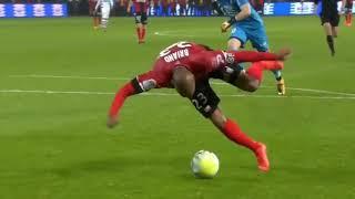 Guingamp's Jimmy Briand tries to score off-balance against rennes fc