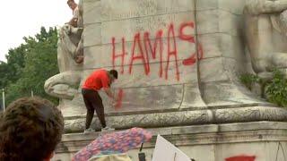 معترضان روی مجسمه کریستف کلمب در واشنگتن دی سی اسپری می کنند "حماس در حال آمدن است"