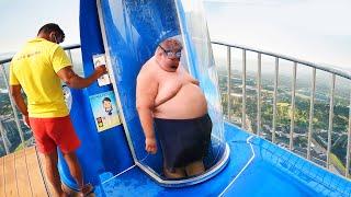 he got stuck in tight water slide..